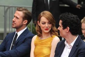 LOS ANGELES, DEC 7 - Ryan Gostling, Emma Stone, Damien Chazelle at the Emma Stone and Ryan Gosling Hand and Foot Print Ceremony at TCL Chinese Theater on December 7, 2016 in Los Angeles, CA photo