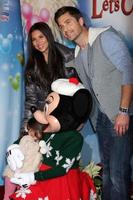 LOS ANGELES, DEC 11 - Eric Winter, Sebella Winter, Roselyn Sanchez, Minnie Mouse at the Disney on Ice Red Carpet Reception at the Staples Center on December 11, 2014 in Los Angeles, CA photo