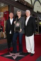 LOS ANGELES, SEP 4 - Ryan Murphy, Jane Lynch, Christopher Guest at the Jane Lynch Hollywood Walk of Fame Star Ceremony on Hollywood Boulevard on September 4, 2013 in Los Angeles, CA photo