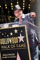 LOS ANGELES, JUL 9 - Charlie Sheen at the Hollywood Walk of Fame Ceremony for Slash at Hard Rock Cafe at Hollywood and Highland on July 9, 2012 in Los Angeles, CA photo