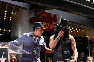 LOS ANGELES, JUL 9 - Charlie Sheen, Slash at the Hollywood Walk of Fame Ceremony for Slash at Hard Rock Cafe at Hollywood and Highland on July 9, 2012 in Los Angeles, CA photo