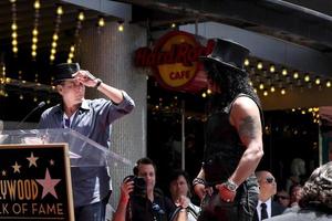 LOS ANGELES, JUL 9 - Charlie Sheen, Slash at the Hollywood Walk of Fame Ceremony for Slash at Hard Rock Cafe at Hollywood and Highland on July 9, 2012 in Los Angeles, CA photo