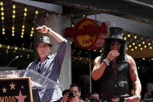 LOS ANGELES, JUL 9 - Charlie Sheen, Slash at the Hollywood Walk of Fame Ceremony for Slash at Hard Rock Cafe at Hollywood and Highland on July 9, 2012 in Los Angeles, CA photo
