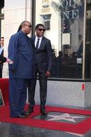 LOS ANGELES, OCT 10 - Stevie Wonder, Kenny Babyface Edmonds at the Kenny Babyface Edmonds Hollywood Walk of Fame Star Ceremony at Hollywood Boulevard on October 10, 2013 in Los Angeles, CA photo