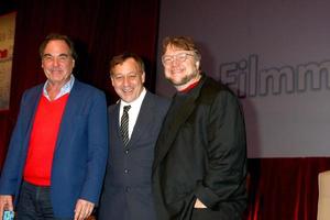 LAS VEGAS, APR 17 - Oliver Stone, Sam Raimi, Guillermo del Toro at the CinemaCon Filmmaker s Luncheon at the Caesars Palace on April 17, 2013 in Las Vegas, NV photo