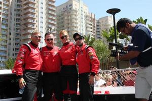 LOS ANGELES, FEB 18 - Dave Pasant, Robert Patrick, Tricia Helfer, Nathan Kress at the Toyota Grand Prix Pro Celeb Race at the Toyota Grand Prix Racecourse on April 18, 2015 in Long Beach, CA photo