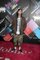 LOS ANGELES, APR 20 - Travis Barker arriving at the Launch Of The New T-Mobile Sidekick 4G at Old Robinson May Building on April 20, 2011 in Beverly Hills, CA photo