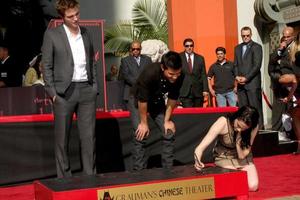 LOS ANGELES, NOV 3 - Robert Pattinson, Taylor Lautner, Kristen Stewart, at the Handprint and Footprint Ceremony for the Twilight Saga Actors at Grauman s Chinese Theater on November 3, 2011 in Los Angeles, CA photo