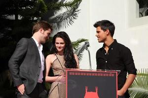 LOS ANGELES, NOV 3 - Robert Pattinson, Kristen Stewart, Taylor Lautner at the Handprint and Footprint Ceremony for the Twilight Saga Actors at Grauman s Chinese Theater on November 3, 2011 in Los Angeles, CA photo