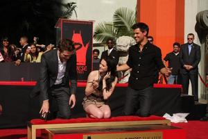 LOS ANGELES, NOV 3 - Robert Pattinson, Kristen Stewart, Taylor Lautner at the Handprint and Footprint Ceremony for the Twilight Saga Actors at Grauman s Chinese Theater on November 3, 2011 in Los Angeles, CA photo