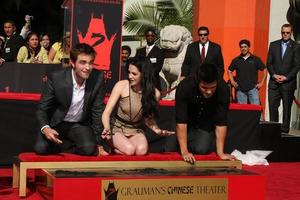 LOS ANGELES, NOV 3 - Robert Pattinson, Kristen Stewart, Taylor Lautner at the Handprint and Footprint Ceremony for the Twilight Saga Actors at Grauman s Chinese Theater on November 3, 2011 in Los Angeles, CA photo