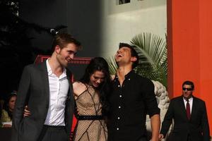 LOS ANGELES, NOV 3 - Robert Pattinson, Kristen Stewart, Taylor Lautner at the Handprint and Footprint Ceremony for the Twilight Saga Actors at Grauman s Chinese Theater on November 3, 2011 in Los Angeles, CA photo