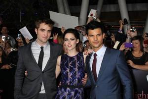 LOS ANGELES, NOV 14 - Robert Pattinson, Kristen Stewart, Taylor Lautner arrives at the Twilight - Breaking Dawn Part 1 World Premiere at Nokia Theater at LA LIve on November 14, 2011 in Los Angeles, CA photo