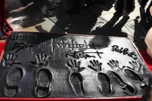 LOS ANGELES, NOV 3 - Robert Pattinson, Kristen Stewart, Taylor Lautner hand and foot prints at the Handprint and Footprint Ceremony for the Twilight Saga Actors at Grauman s Chinese Theater on November 3, 2011 in Los Angeles, CA photo