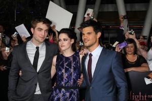 LOS ANGELES, NOV 14 - Robert Pattinson, Kristen Stewart, Taylor Lautner arrives at the Twilight - Breaking Dawn Part 1 World Premiere at Nokia Theater at LA LIve on November 14, 2011 in Los Angeles, CA photo