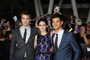 LOS ANGELES, NOV 14 - Robert Pattinson, Kristen Stewart, Taylor Lautner arrives at the Twilight - Breaking Dawn Part 1 World Premiere at Nokia Theater at LA LIve on November 14, 2011 in Los Angeles, CA photo