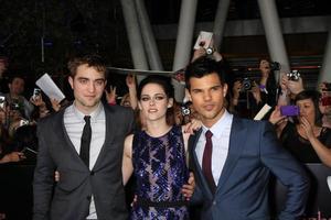 LOS ANGELES, NOV 14 - Robert Pattinson, Kristen Stewart, Taylor Lautner arrives at the Twilight - Breaking Dawn Part 1 World Premiere at Nokia Theater at LA LIve on November 14, 2011 in Los Angeles, CA photo
