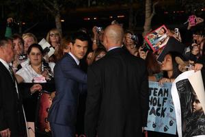 LOS ANGELES, NOV 14 - Taylor Lautner signing autographs at the Twilight - Breaking Dawn Part 1 World Premiere at Nokia Theater at LA LIve on November 14, 2011 in Los Angeles, CA photo