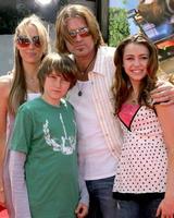 LOS ANGELES, APR 30 - Billy Ray Cyrus and daughter Miley Cyrus arrive at the Over the Hedge LA Premiere at Mann s Village Theater on April 30, 2006 in Westwood, CA photo