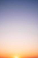 beautiful gradient orange clouds and sunlight on the blue sky perfect for the background, take in everning,Twilight photo