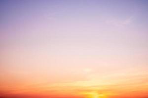 beautiful gradient orange clouds and sunlight on the blue sky perfect for the background, take in everning,Twilight photo