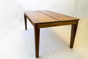 designer coffee table, solid wood base and top in terrazzo, oak wood on white background photo