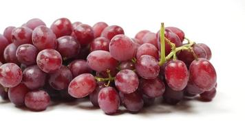 Red grapes on white background, close up video