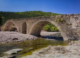 day view of old Roman stone bridge near village Nenkovo. Bulgaria photo