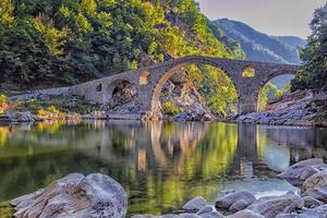 Devil's bridge - old stone bridje near Ardino, Bulgaria photo