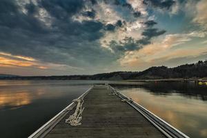 Calm and mood view at the sunset on the sea pier. photo