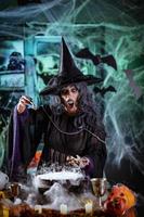Witch Is Cooking Magic Potion With Bones photo