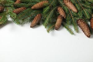 Holidays greeting card or banner composition with pine tree branches. Merry Christmas background and Happy New Year 2023. photo
