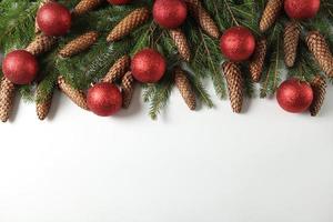 Holidays greeting card or banner composition with pine tree branches. Merry Christmas background and Happy New Year 2023. photo