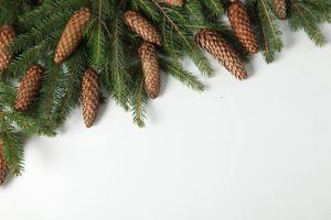 Holidays greeting card or banner composition with pine tree branches. Merry Christmas background and Happy New Year 2023. photo