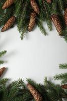 Holidays greeting card or banner composition with pine tree branches. Merry Christmas background and Happy New Year 2023. photo