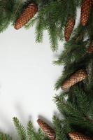 Holidays greeting card or banner composition with pine tree branches. Merry Christmas background and Happy New Year 2023. photo