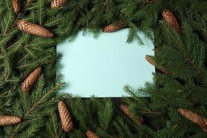 Holidays greeting card or banner composition with pine tree branches. Merry Christmas background and Happy New Year 2023. photo