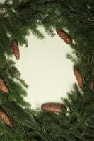 Holidays greeting card or banner composition with pine tree branches. Merry Christmas background and Happy New Year 2023. photo