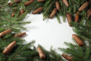 Holidays greeting card or banner composition with pine tree branches. Merry Christmas background and Happy New Year 2023. photo