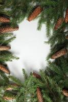 Holidays greeting card or banner composition with pine tree branches. Merry Christmas background and Happy New Year 2023. photo