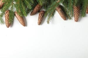Holidays greeting card or banner composition with pine tree branches. Merry Christmas background and Happy New Year 2023. photo