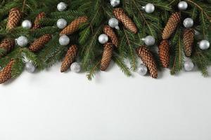 Holidays greeting card or banner composition with pine tree branches. Merry Christmas background and Happy New Year 2023. photo