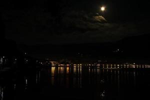 The moon above the lake photo