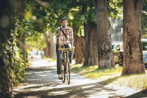 Handsome Man Riding Bicycle photo