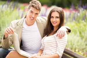 Young Couple In A Park With Laptop photo