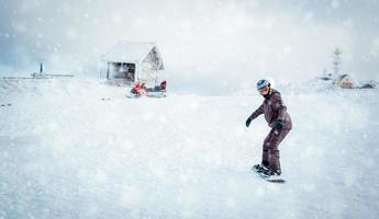 Snowboarder on snow photo