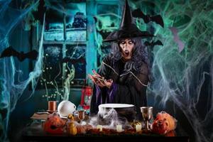 Witch Is Cooking Magic Potion With Bones photo