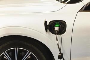 Electric car charging station with vehicle charing batteries. Future of Transportation. photo