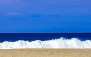 Extremely huge big surfer waves at beach Puerto Escondido Mexico. photo