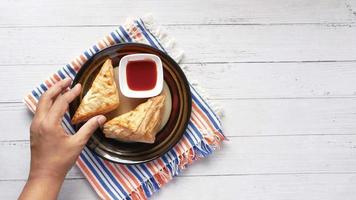 Triangle croissants and sauce on plate video